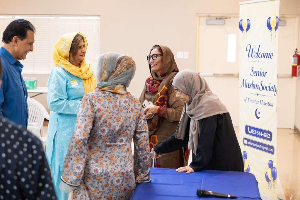 Members greeting each other at an SMSGH welcome event